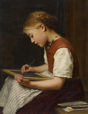 A young girl writing